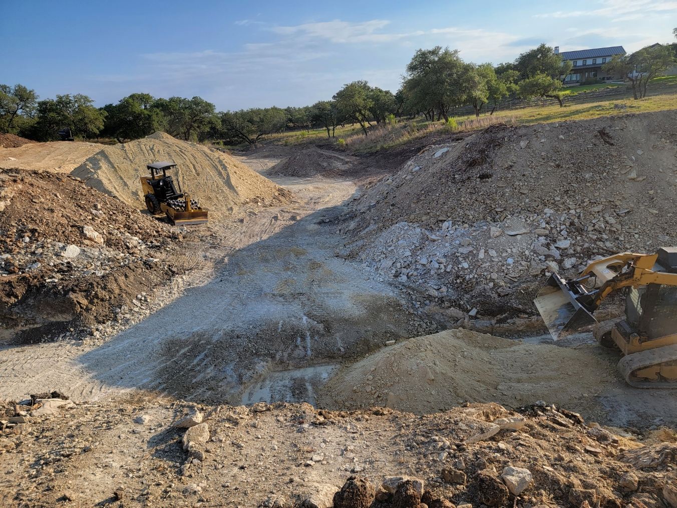 Cut and fill work with dozer and loader on a build site