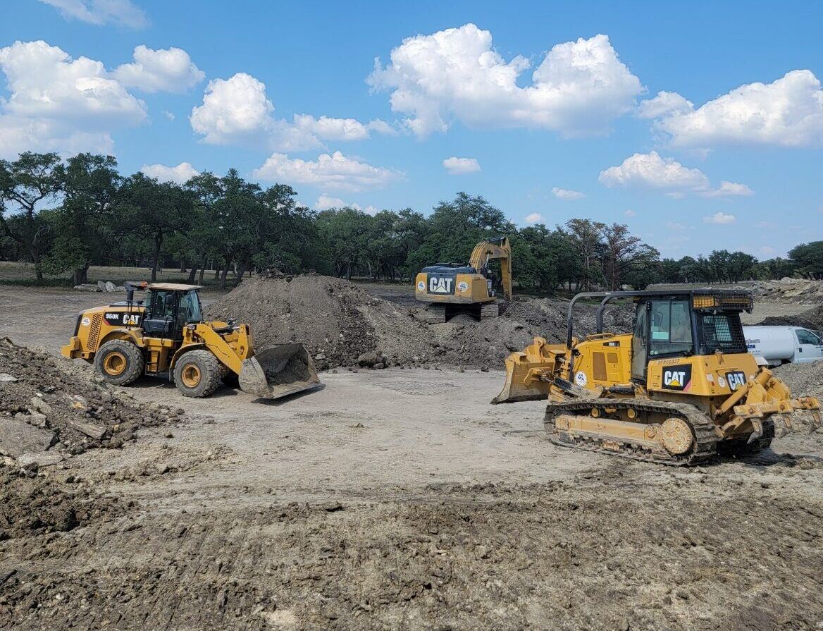 Dozer and loader shaping a lake bottom