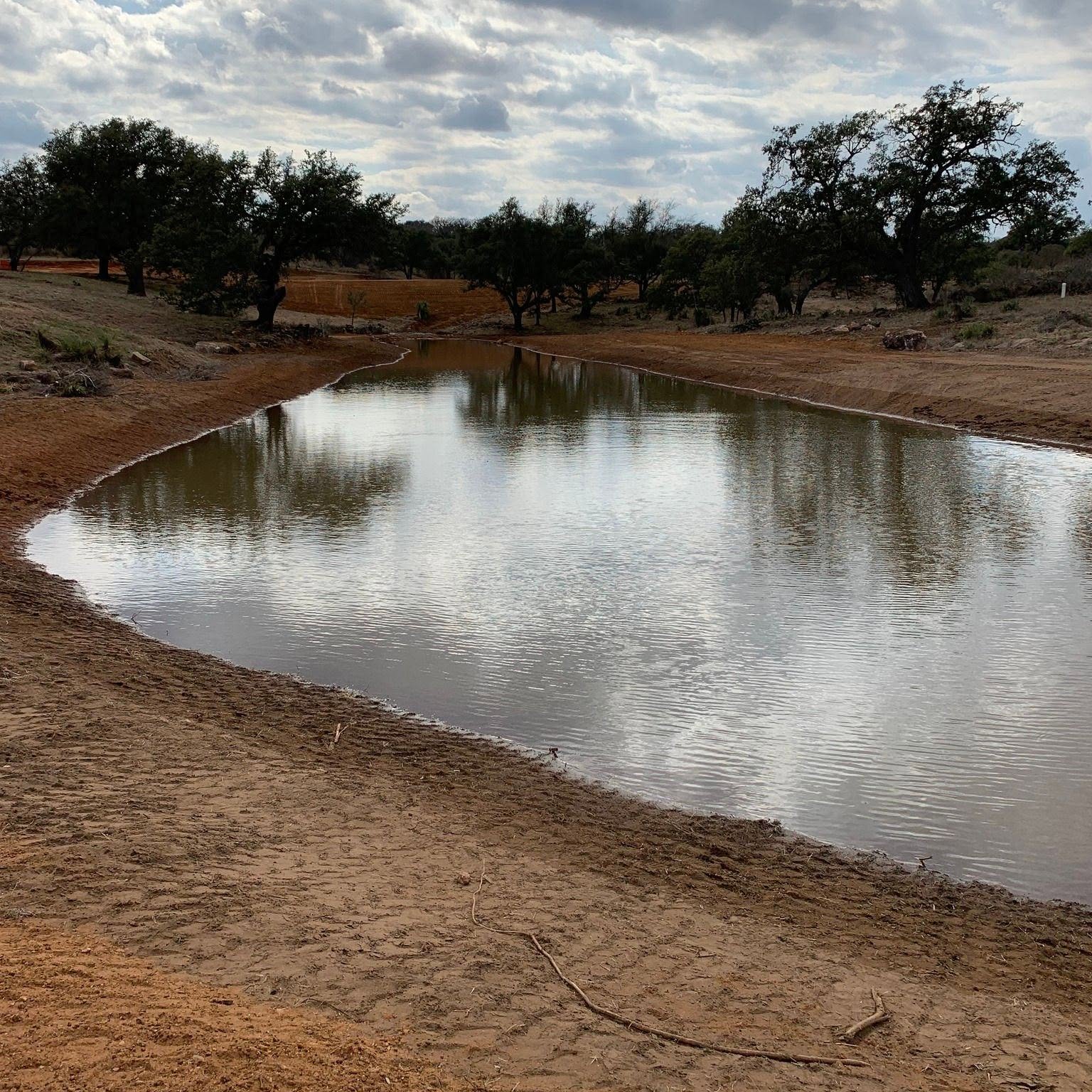 Ranch tank holding water through the dry months