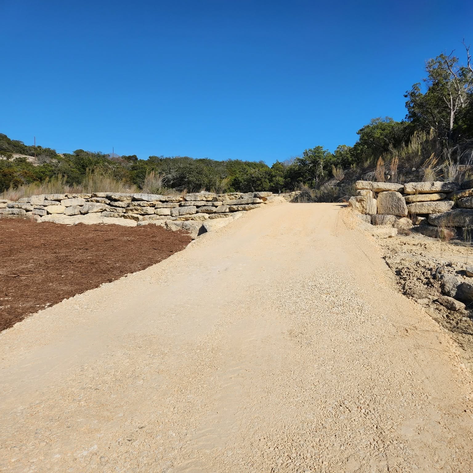 Access road cut through rock to reach a work site